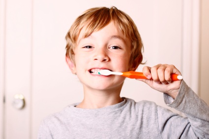 Ann Arbor, MI boy brushing his teeth before visiting the dentist.