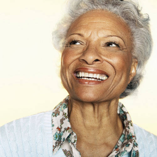 Person smiling after dental implant procedure, at Greashaber Dentistry in Ann Arbor, MI.