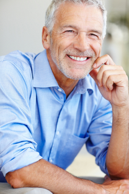 Man smiling with new dentures from Greashaber Dentistry in Ann Arbor, MI